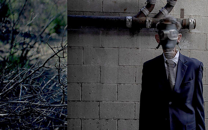 Man in mask against a wall.