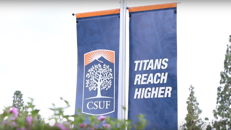 A banner displays the slogan Titans Reach Higher