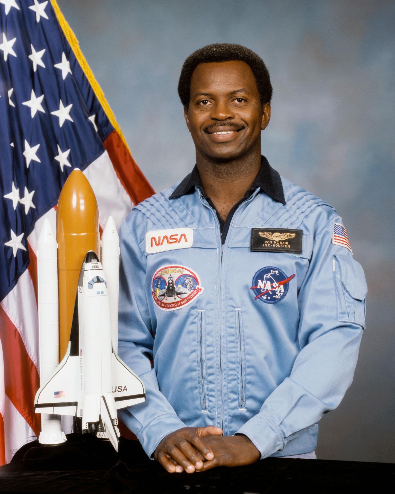 Ronald E. McNair smiling in an astronaut suit