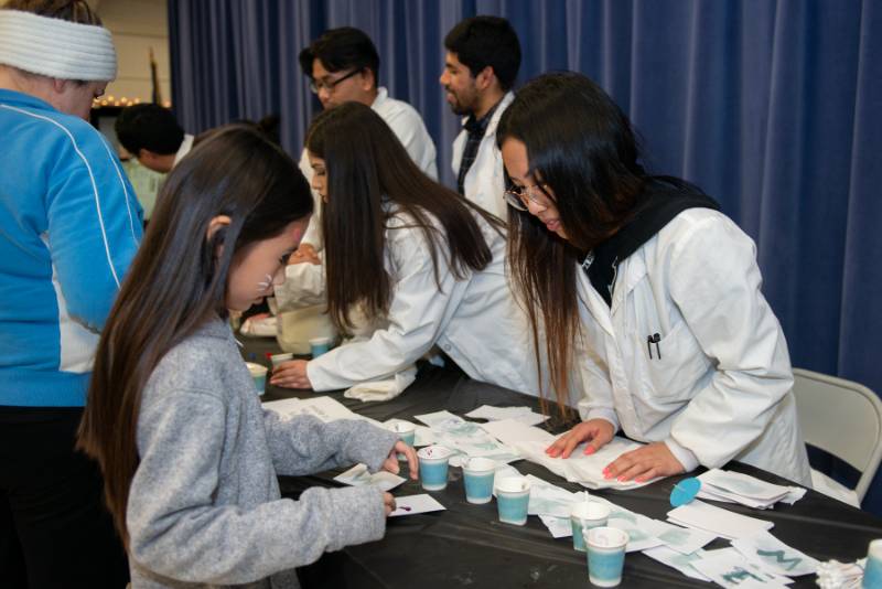 A young girl participating in a demo. 