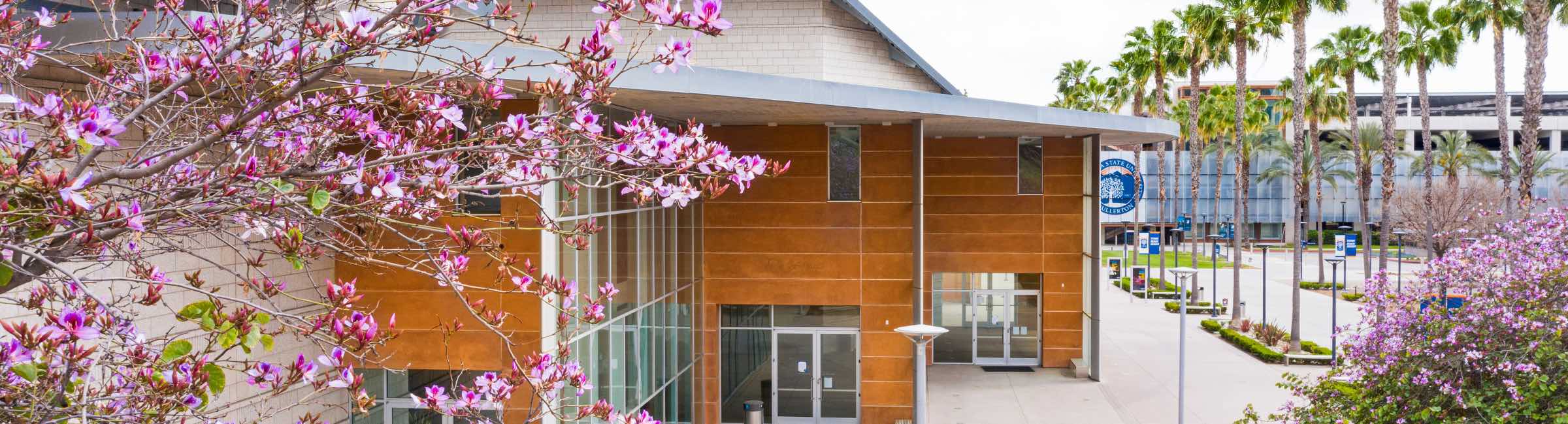 Pink flowers in front of Clayes Performing Arts Building 